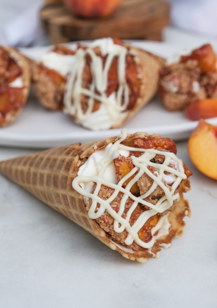 Stuffed waffle cone topped with a drizzle of white chocolate. 