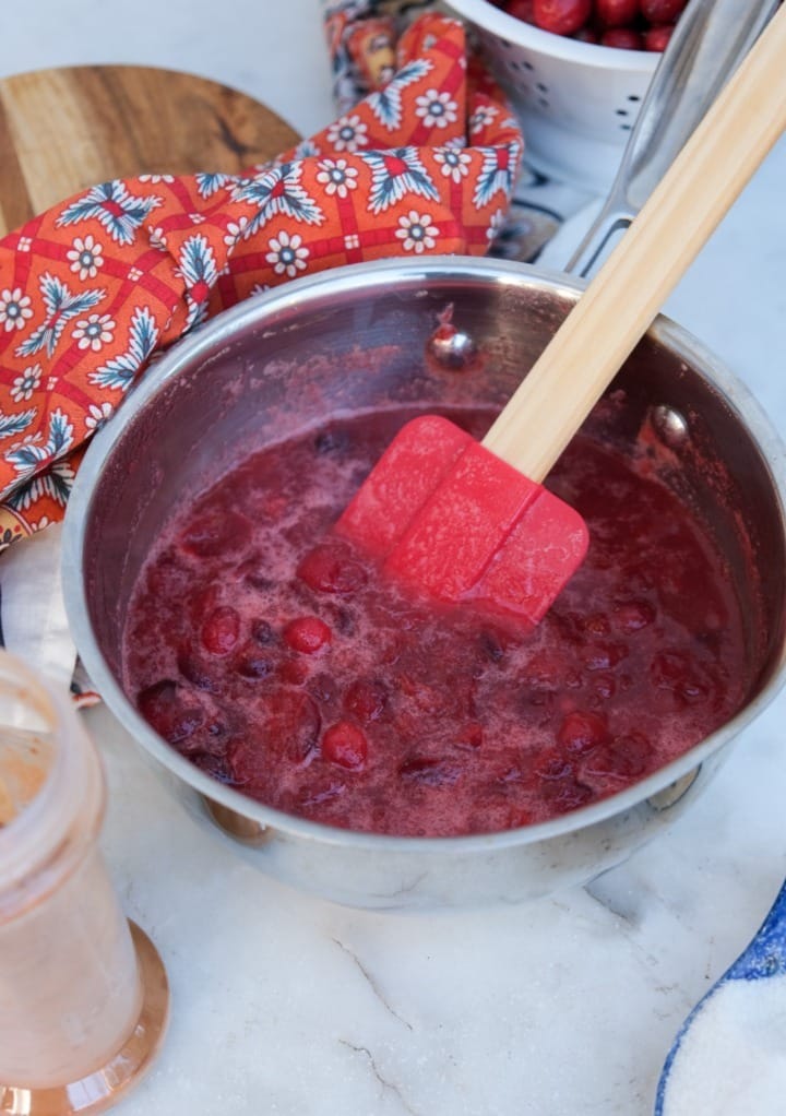 Homemade cranberry sauce in a stainless steel saucepan. 