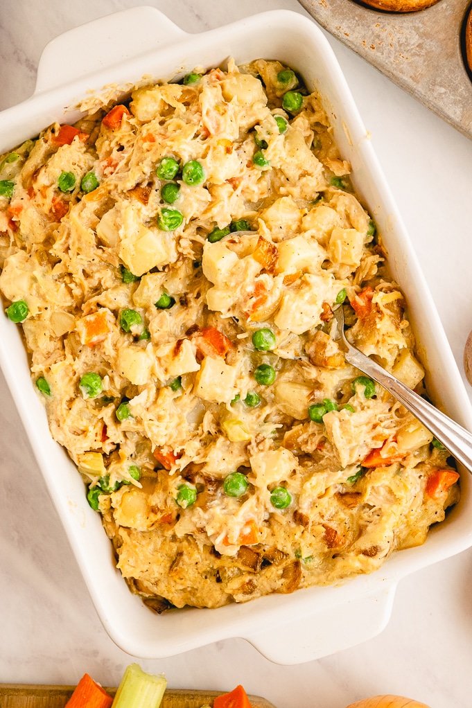 Casserole dish filled with chicken pot pie in a white baking dish. 