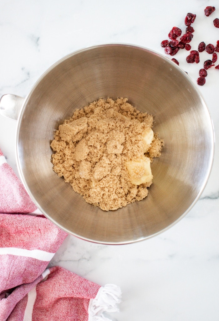 Butter and brown sugar in a mixing bowl. 