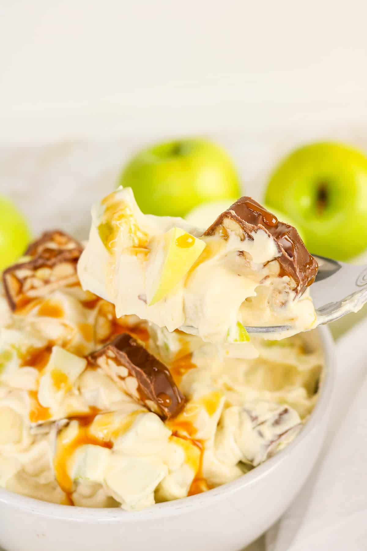 A forkful of apple snickers salad.