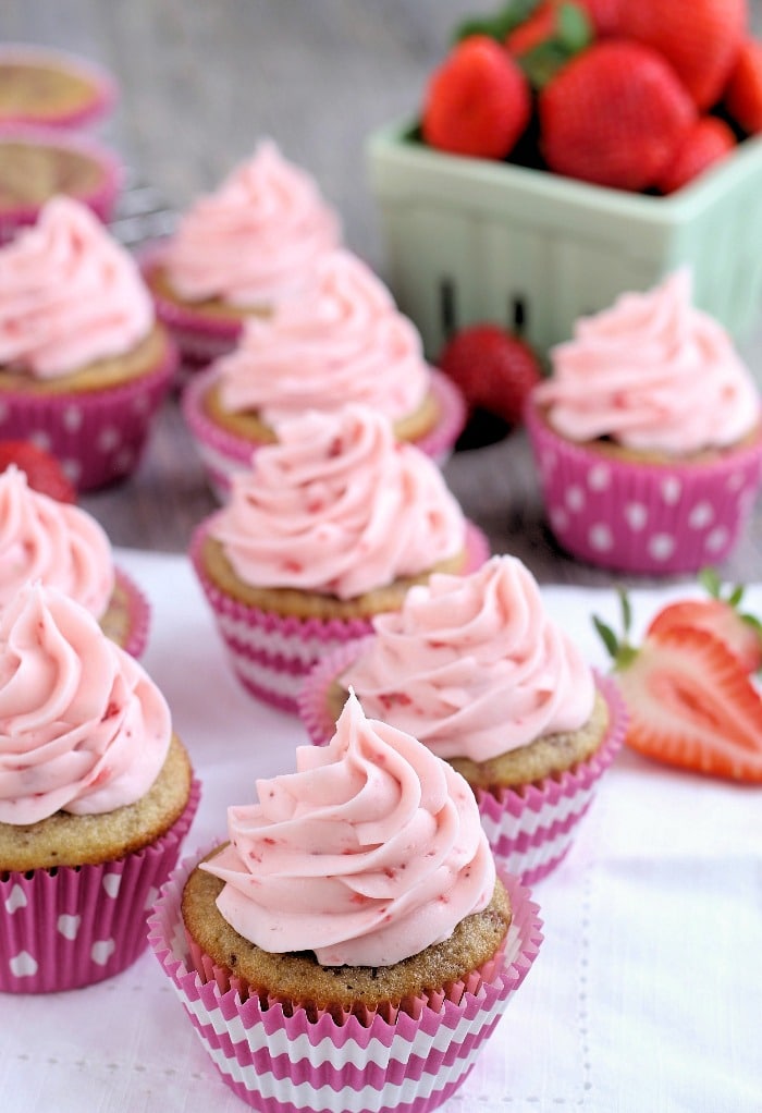 Strawberry cupcakes on a white napkin ready to be eaten