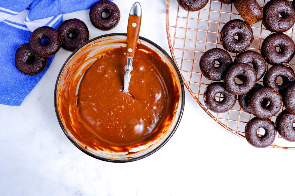 Melted chocolate glaze in small mixing bowl before dipping donuts. 