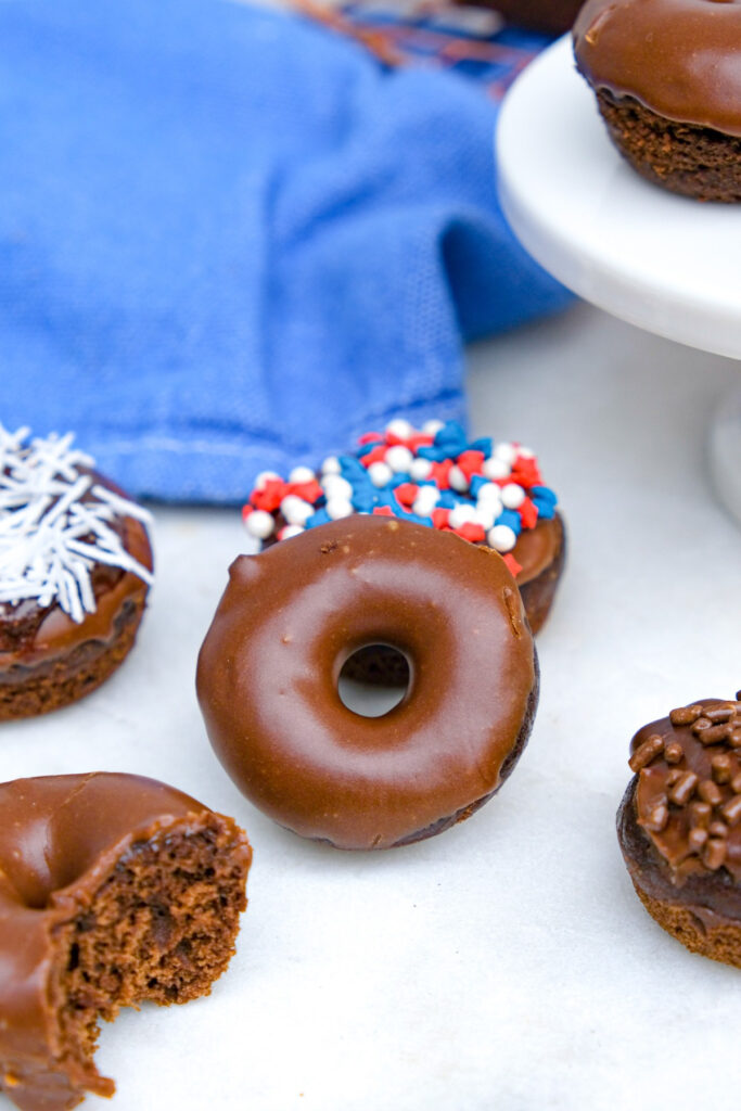 Chocolate donuts dipped in a chocolate glaze. 