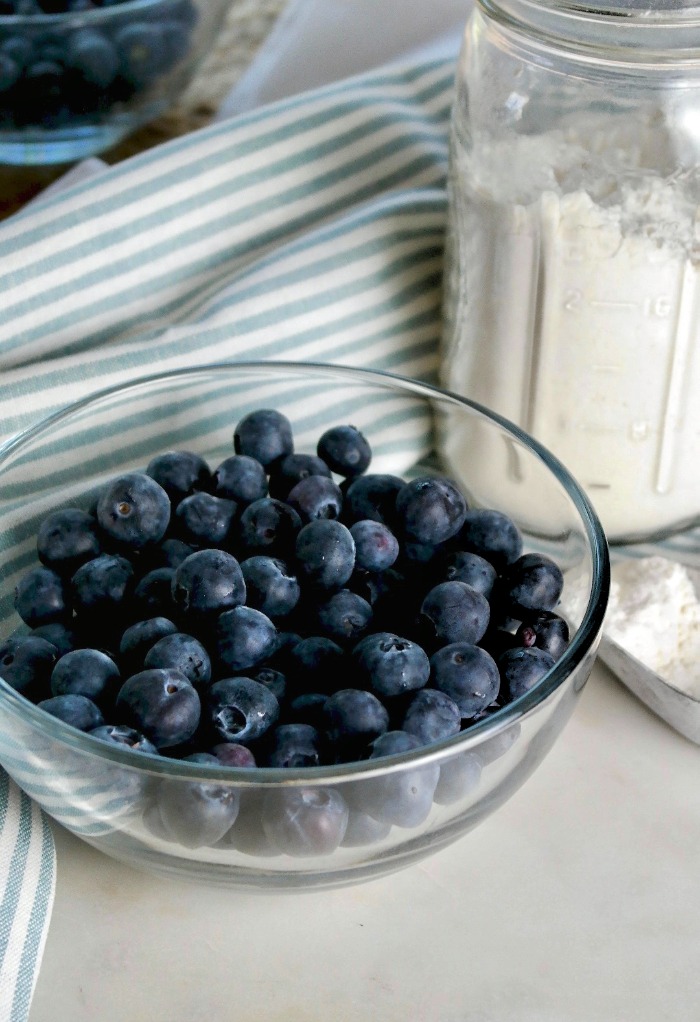 Fresh blueberries in a clear glass bowl