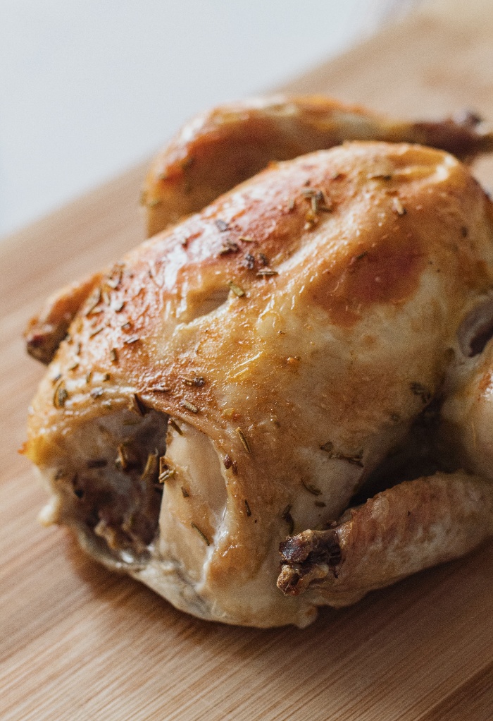 Roasted chicken on a cutting board. 