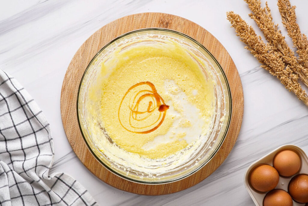 Wet ingredients in a clear mixing bowl for baking cupcakes. 