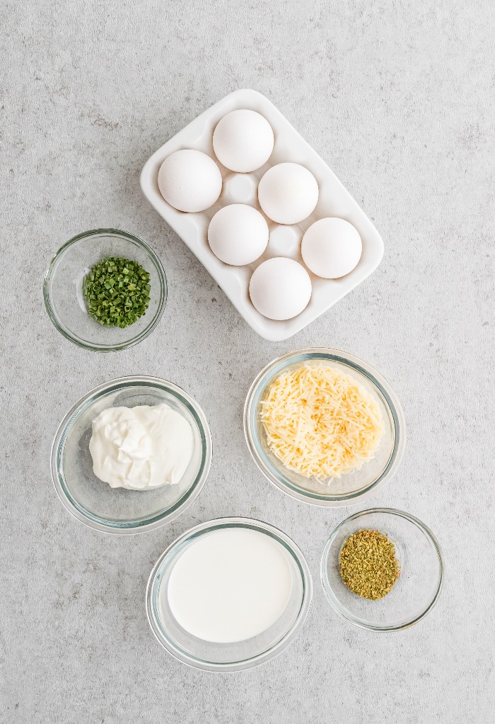 Ingredients to make sour cream and chives egg cups. 