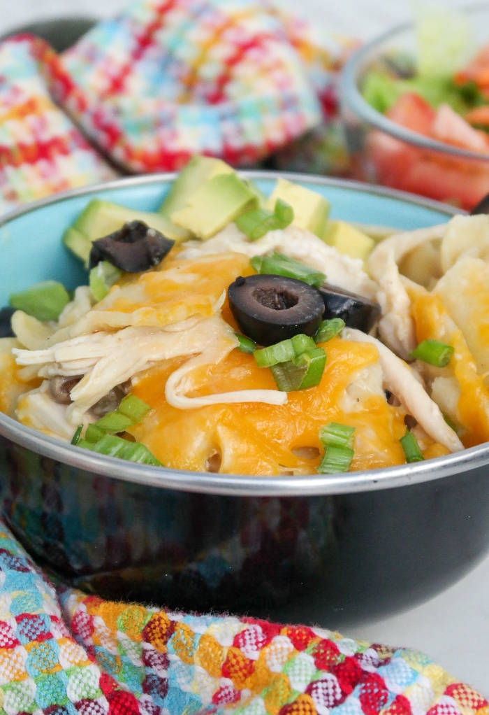 A black bowl filled with enchilada skillet meal. 