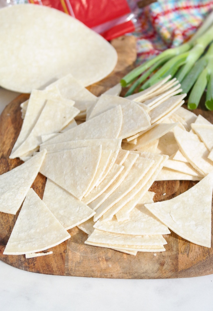 Corn tortillas sliced in triangles.