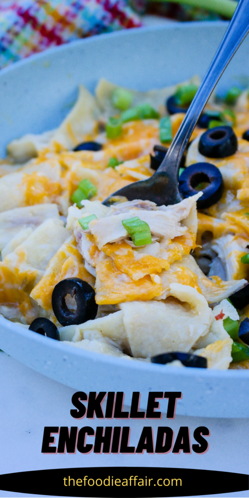 Easy chicken enchiladas made in a skillet topped with cheese. #enchilada #EasyRecipe #Mexican #30MinuteMeal