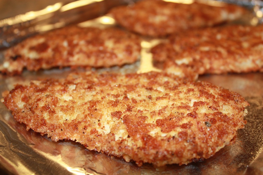 The Best Chicken Parmesan filets lightly fried and then baked to perfection | www.thefoodieaffair.com