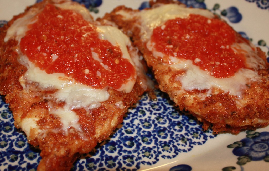 The Best Chicken Parmesan with a crispy coating and dollop of cheese and sauce | www.thefoodieaffair.com
