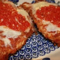 parmesan chicken on a blue platter