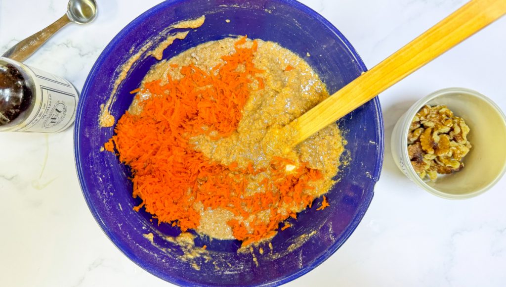 Shredded carrots added to the muffin batter.
