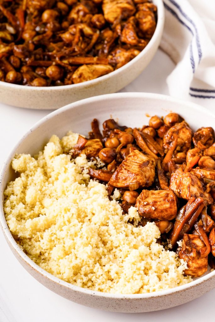 Chickpea stew with chicken in a white bowl. 