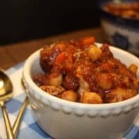 chickpea and chicken saucy garbanzo meal in a white bowl