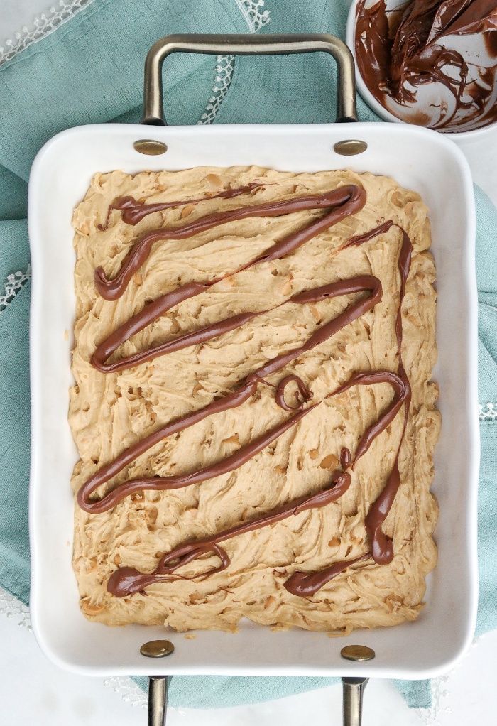 Bottom layer of cookie dough with melted chocolate. 