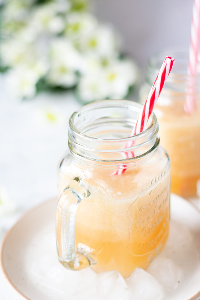 homemade pineapple melon smoothie in a clear mason jar