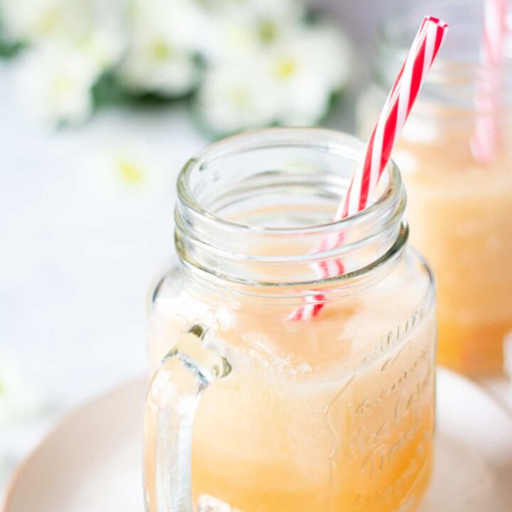 homemade pineapple melon smoothie in a clear mason jar