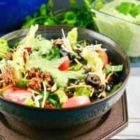 Taco salad in a brown bowl