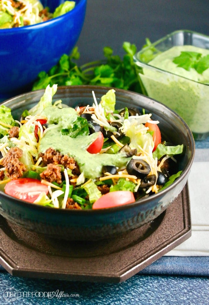 Taco salad in a brown bowl