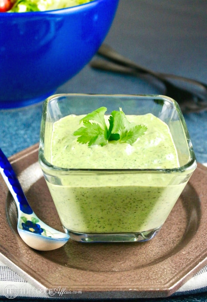 Cilantro dressing in a clear square bowl 