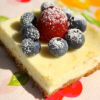 Lemon cheesecake topped with fresh berries.