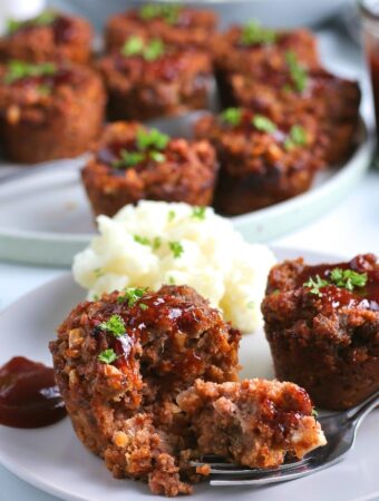 Here we see the finished easy meatloaf recipe baked to perfection and served with mashed potatoes.