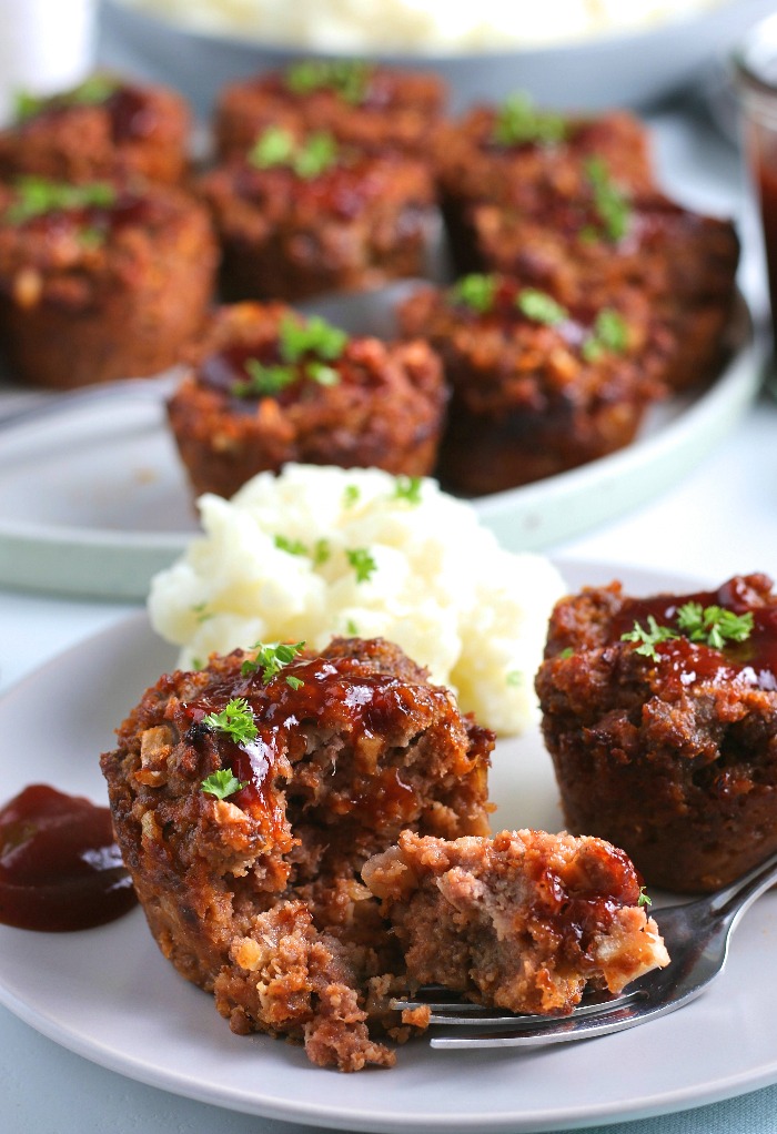 Here we see the finished easy meatloaf recipe baked to perfection and served with mashed potatoes.