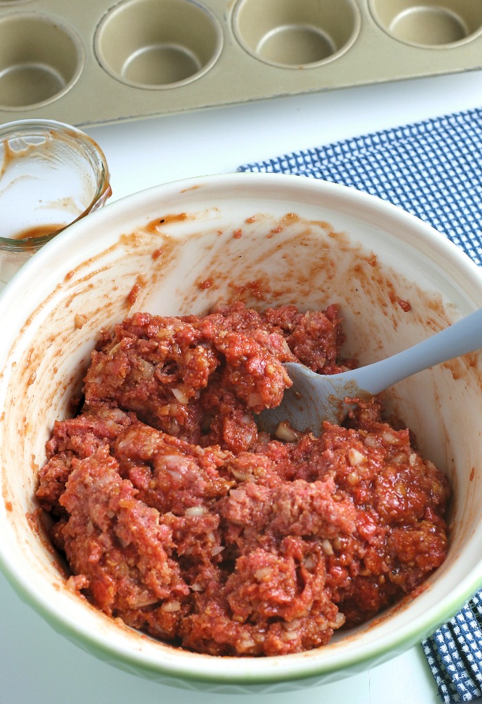 Here we see the base of the how to make meatloaf ingredients being mixed in a bowl. 