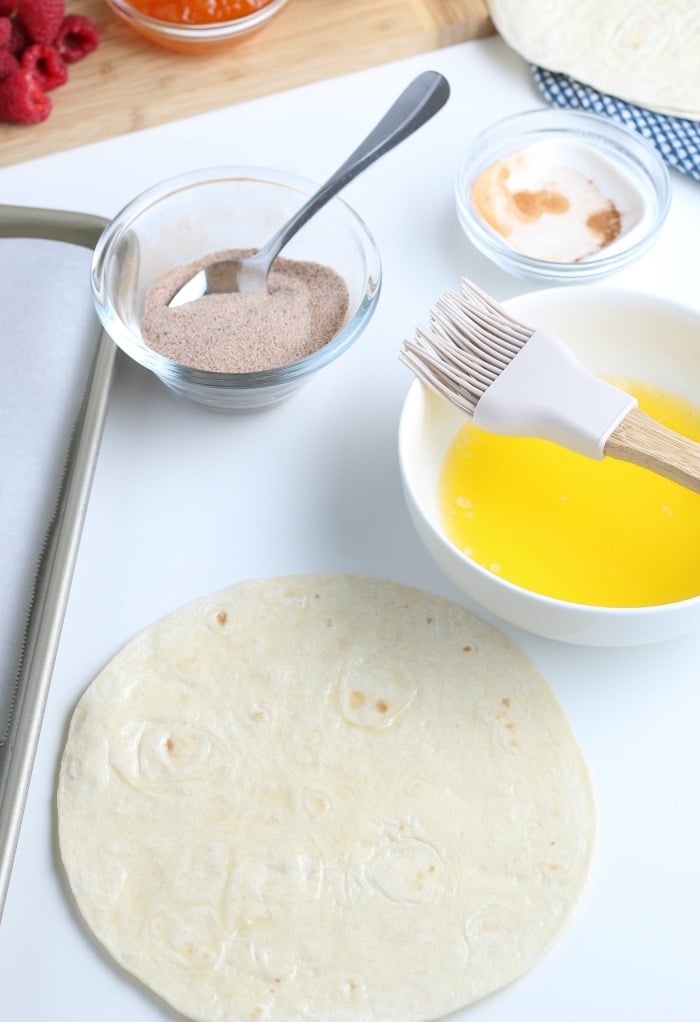 Melted butter and tortillas for cinnamon chips