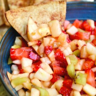 Fruit salsa dip with a cinnamon chip.