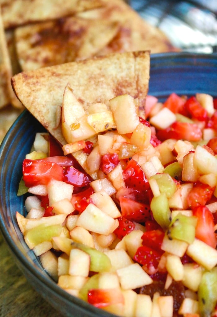 Fruit salsa dip with a cinnamon chip.