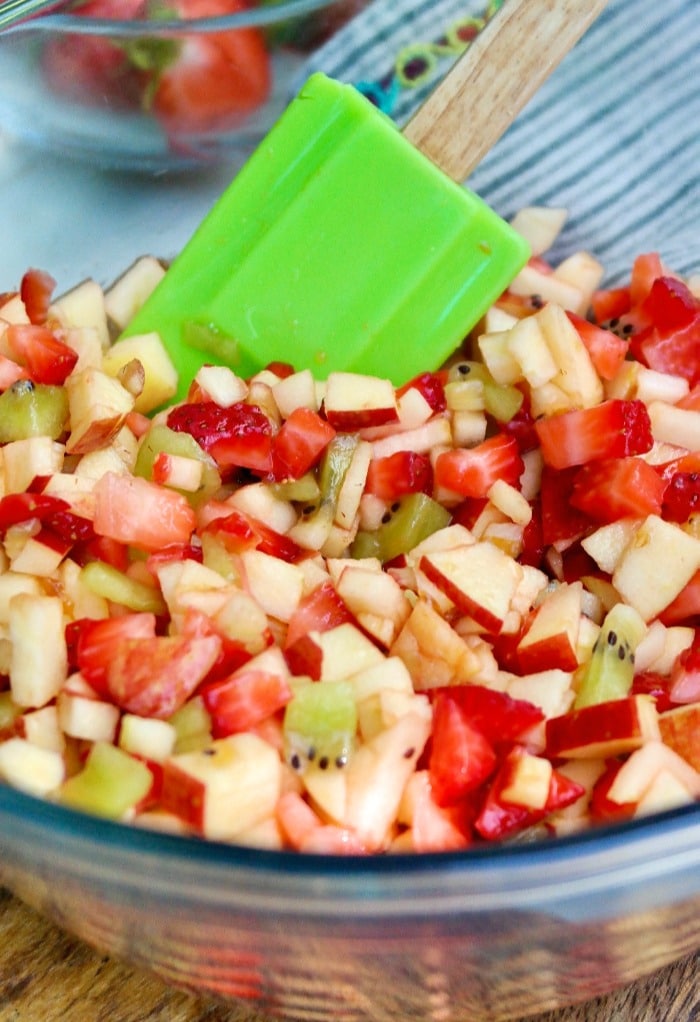 Fruit salsa mixed with all the ingredients ready to be placed in a serving bowl