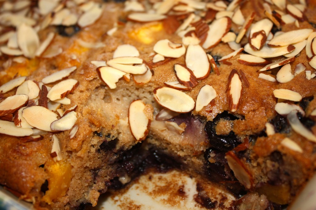 Peach Blueberry Buckle made with fresh fruit and whole wheat flour! Top with sliced almonds and a sprinkle of powdered sugar!