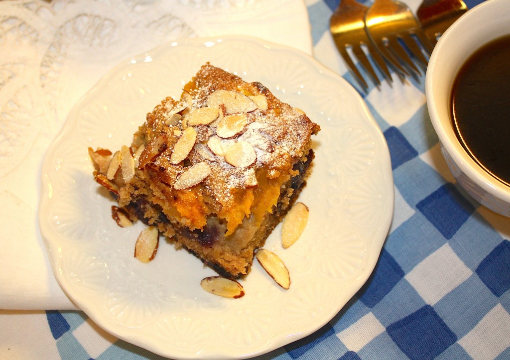 Peach Blueberry Buckle made with fresh fruit and whole wheat flour! Top with sliced almonds and a sprinkle of powdered sugar! 