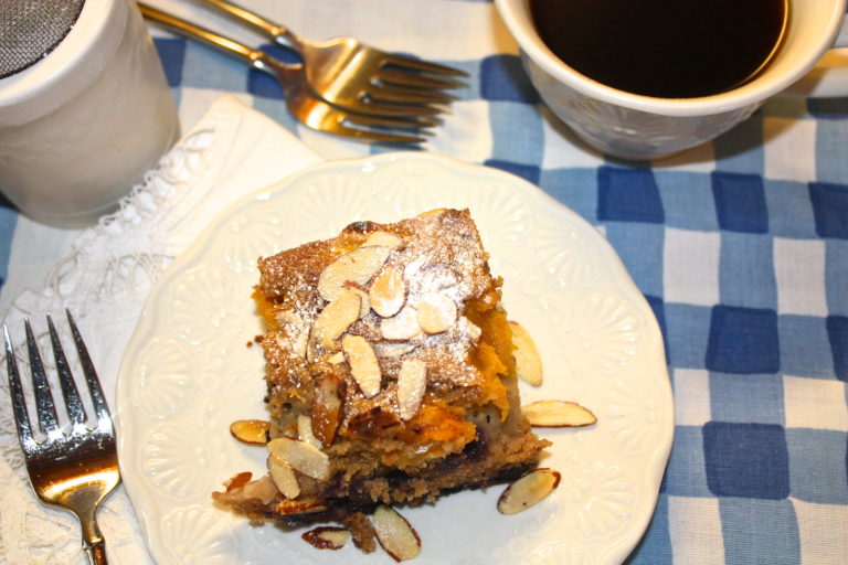 Peach Blueberry Buckle made with fresh fruit and whole wheat flour! Top with sliced almonds and a sprinkle of powdered sugar!