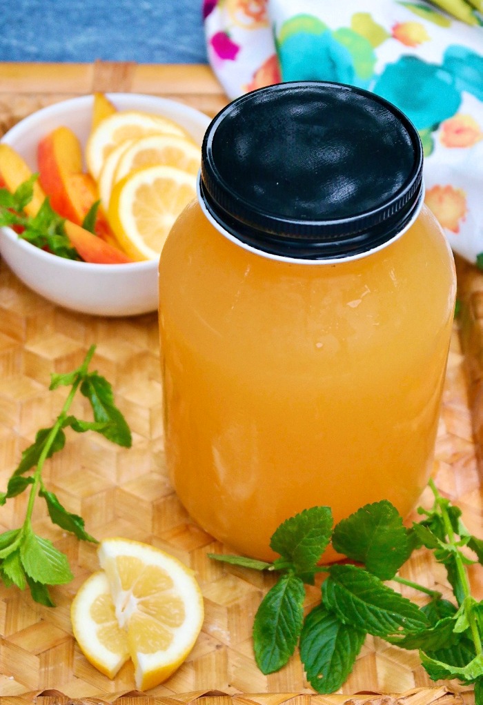 Mason jar filled with homemade peach lemonade