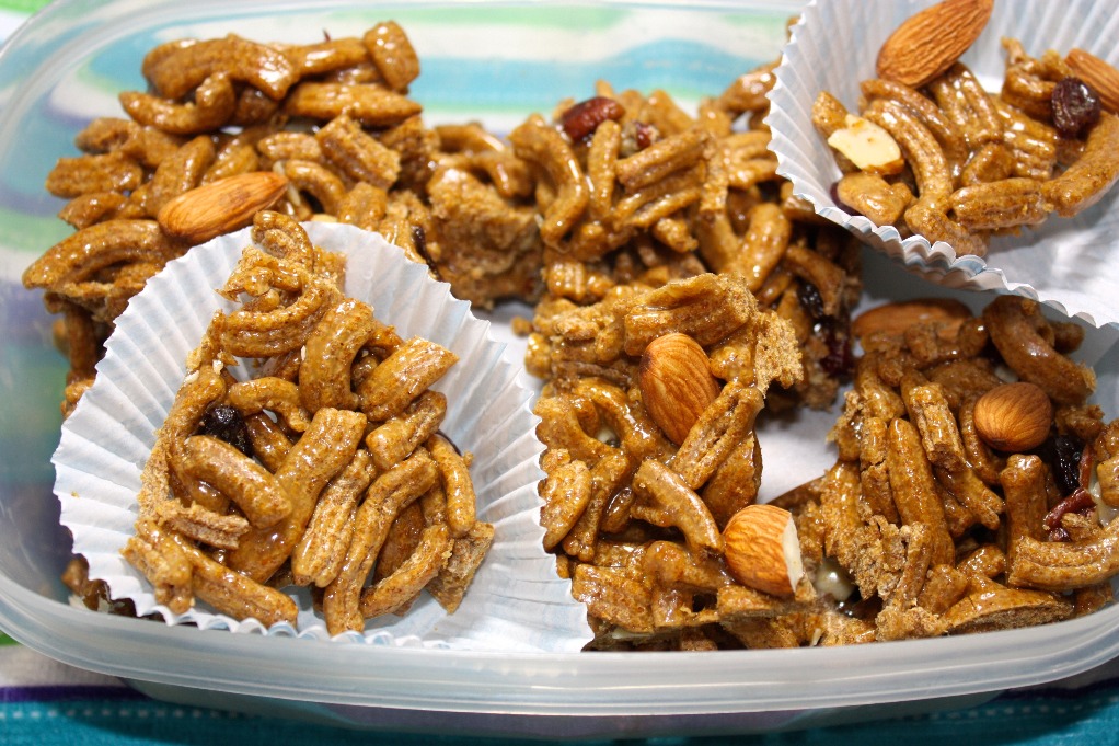 cereal bar clusters in a baking liner placed in a plastic container