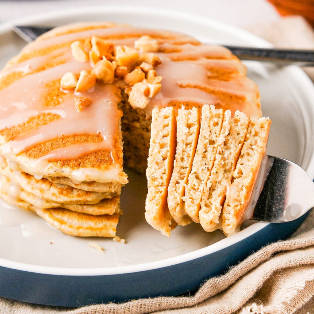 Macadamia nut pancakes on a serving plate.