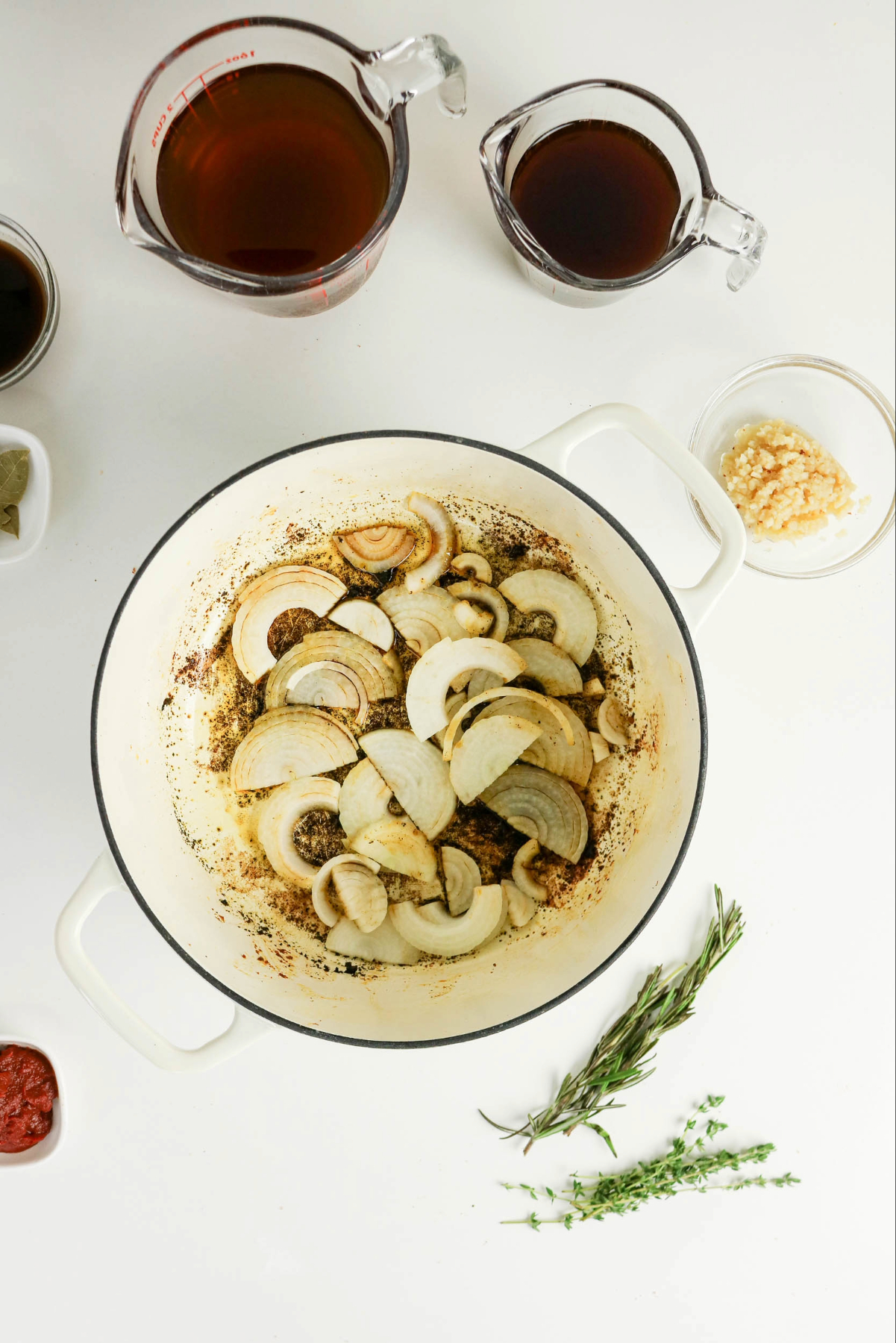 Sliced onion in a Dutch pan.