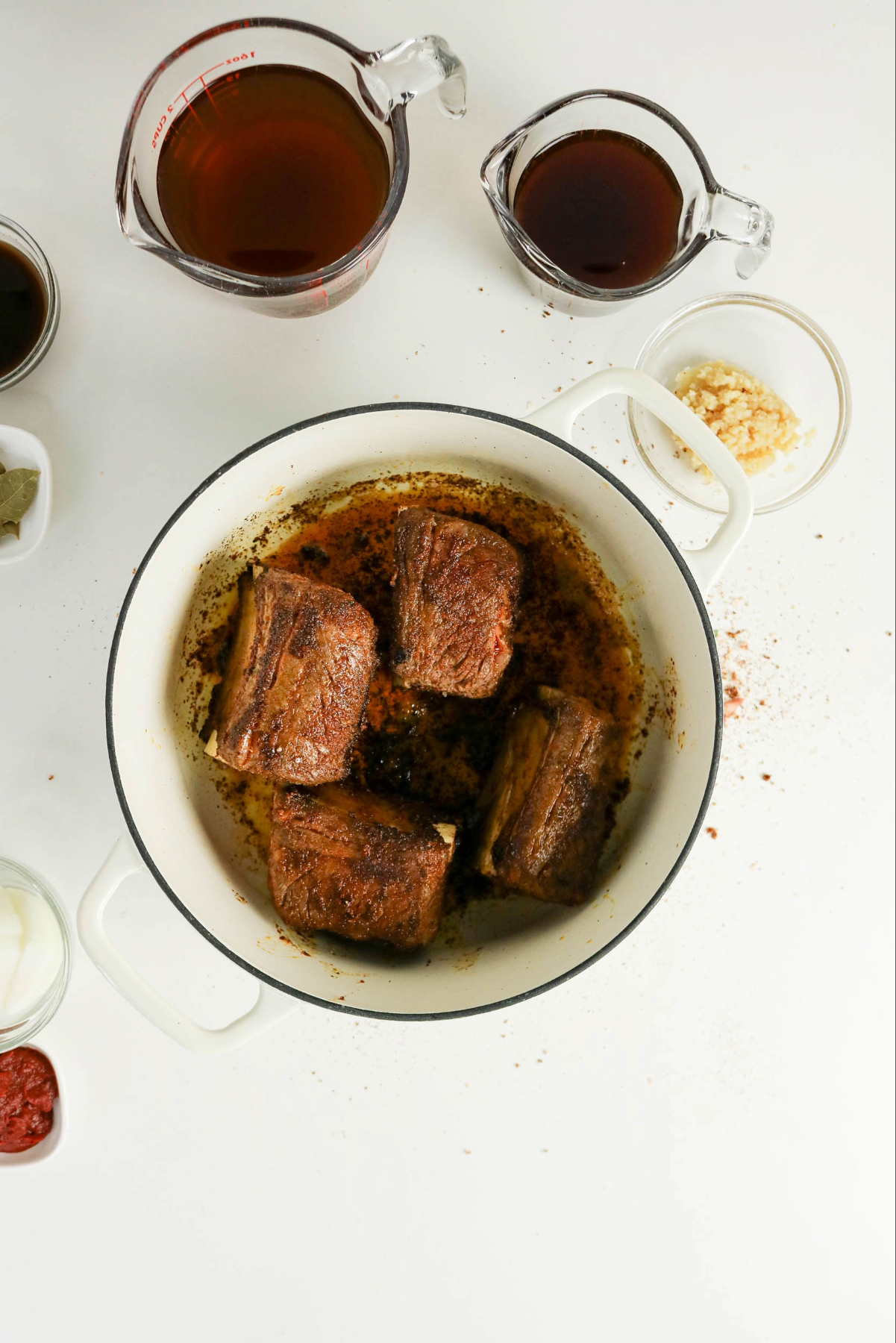 Searing beef ribs in a Dutch oven.