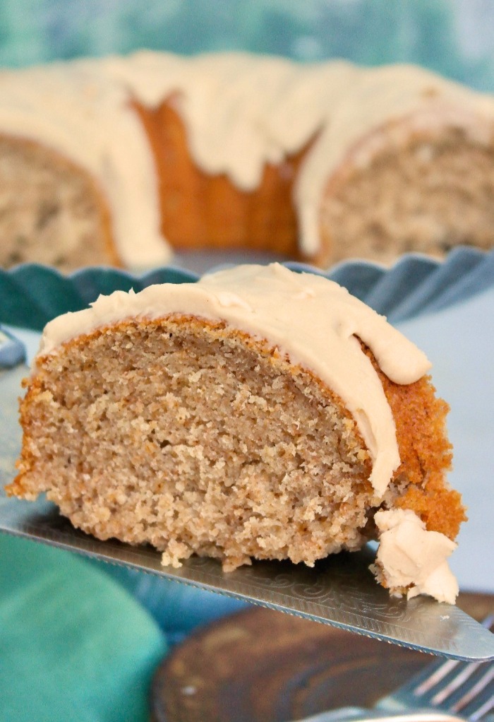 A slice of spice bundt cake on a serving spatula.