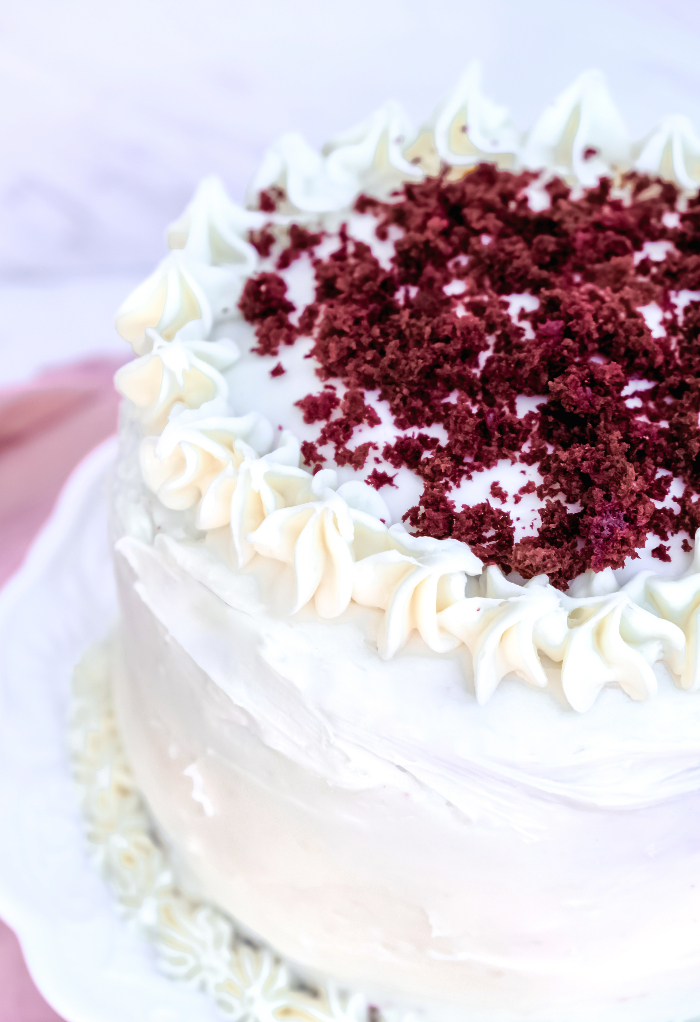 Top view of red velvet cake on a cake platter.