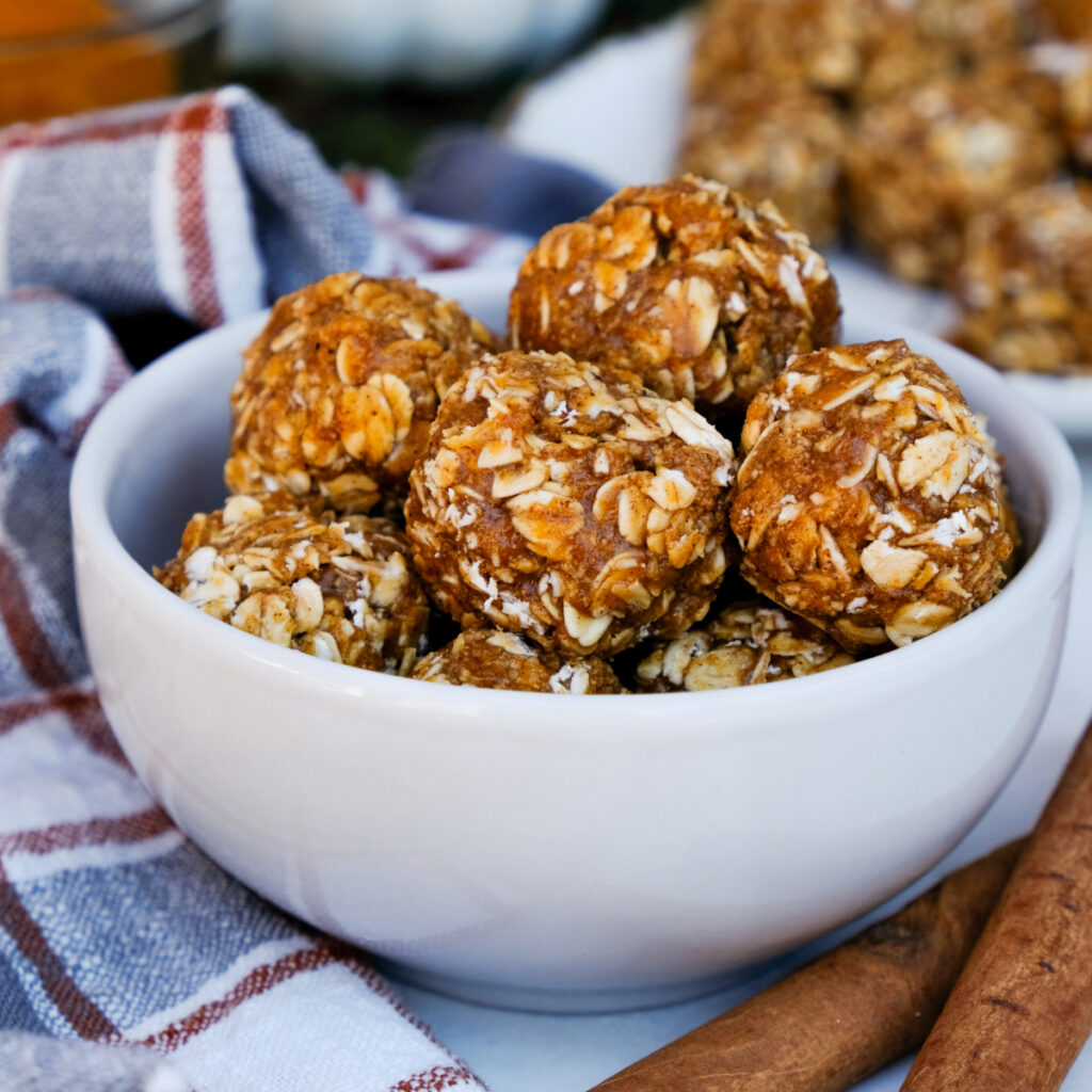 No-bake pumpkin protein bites in a small serving bowl.