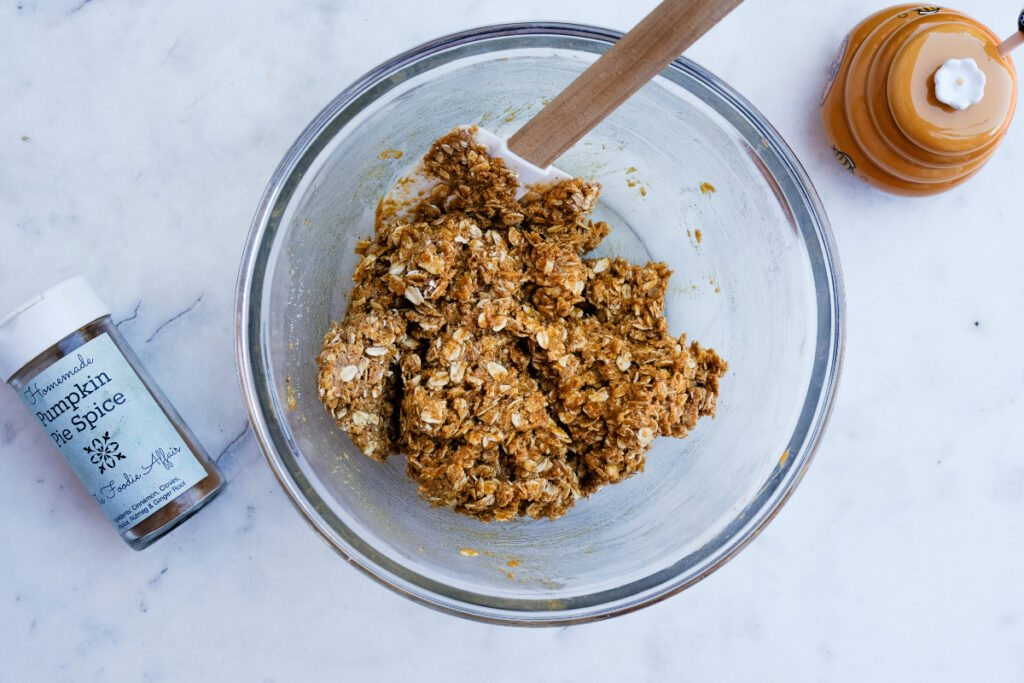 No-bake pumpkin ball mix in a mixing bowl before refrigerating.