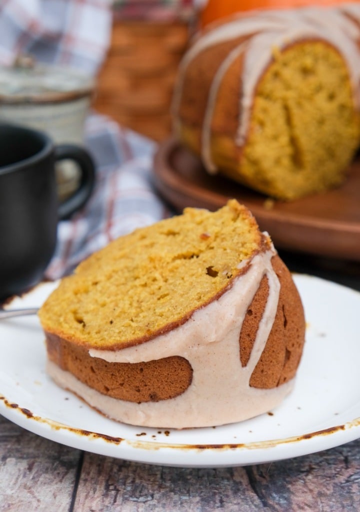 A slice of pumpkin pound cake on a white plate. 