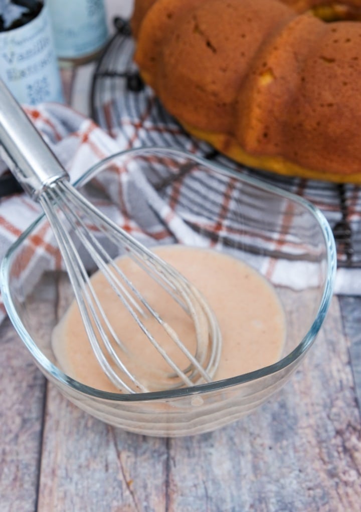 Glaze in a clear mixing bowlto top on a cake. 