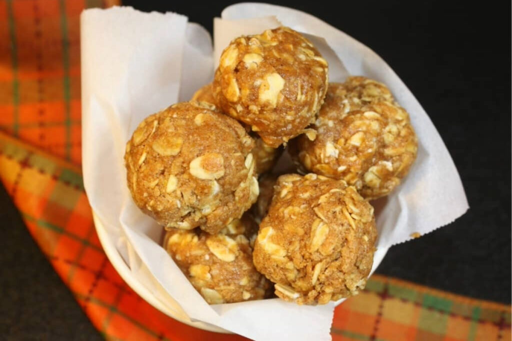 Top view of pumpkin bites wrapped in wax paper. 